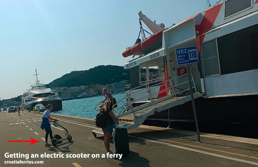 dismantling electric scooter to embark on the catamaran/ferry 
